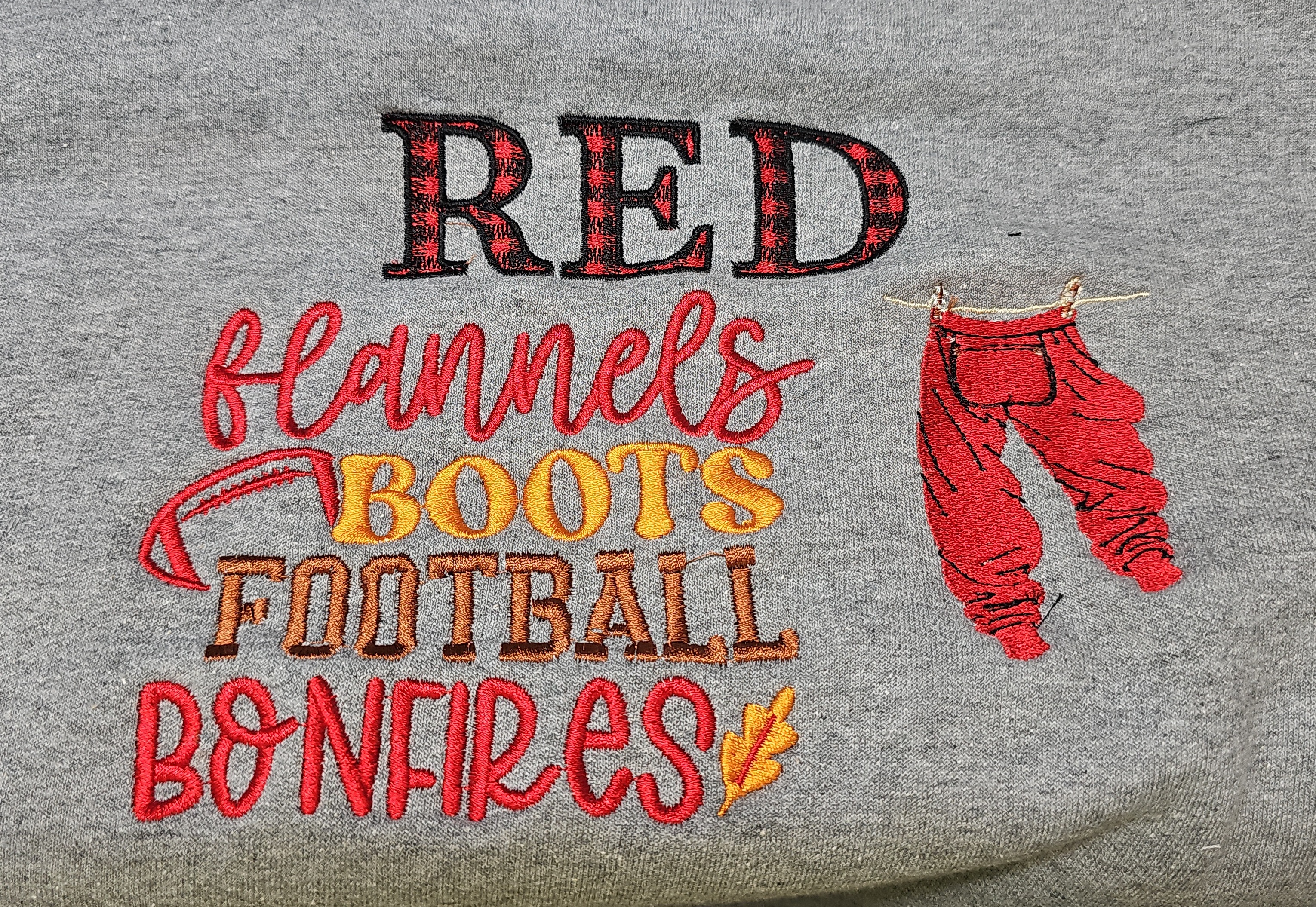 Red Flannels, Boots, Football, Bonfires lettering embroidered on gray apparel
