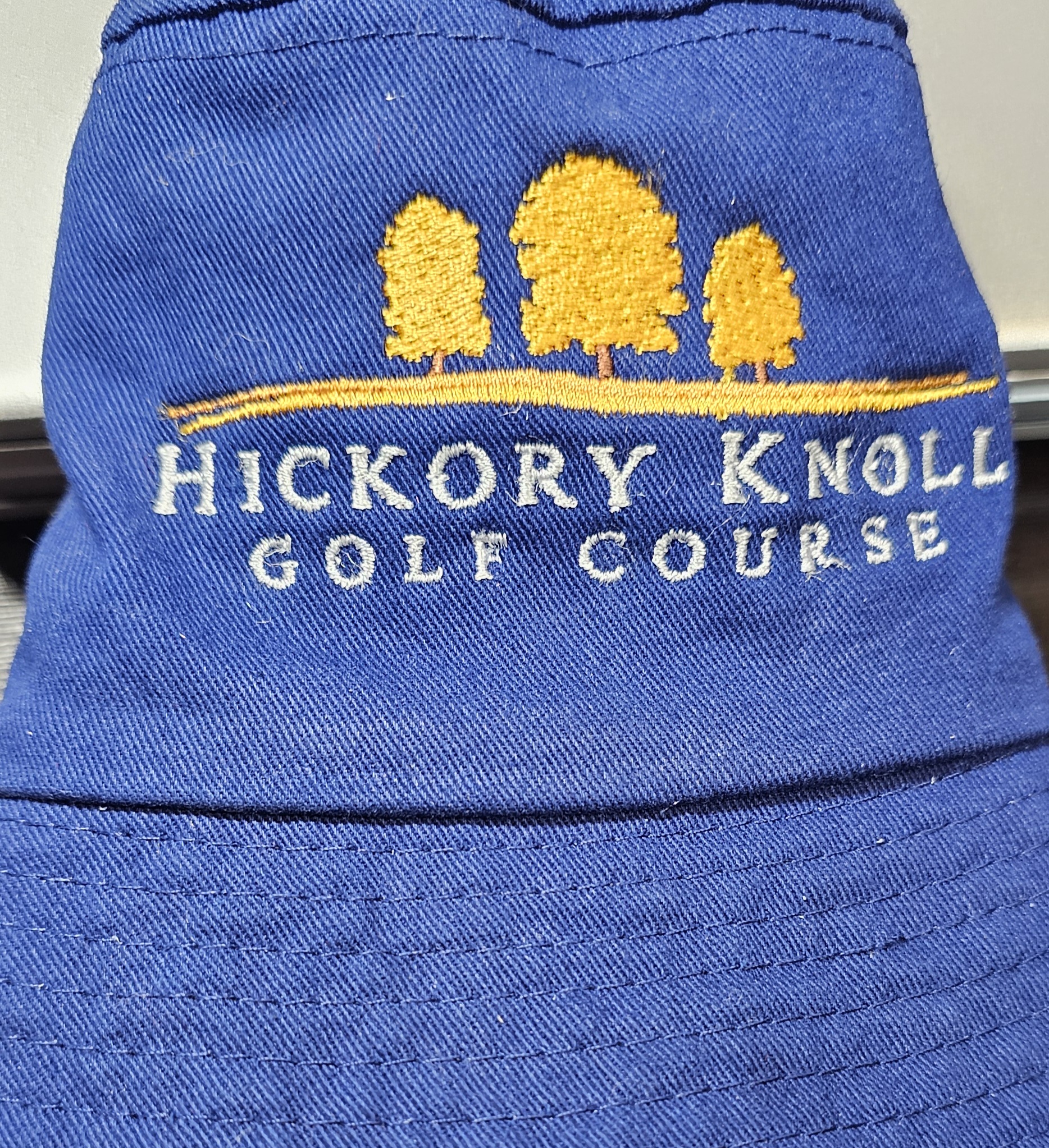 Blue hat with Hickory Knoll Golf Course embroidery