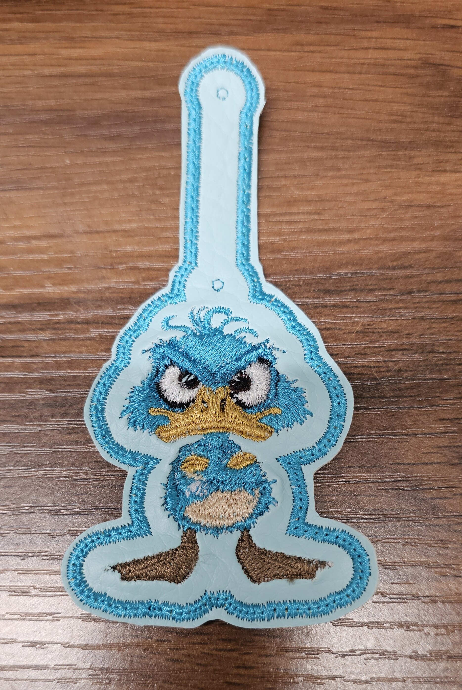 Blue character embroidered key fob