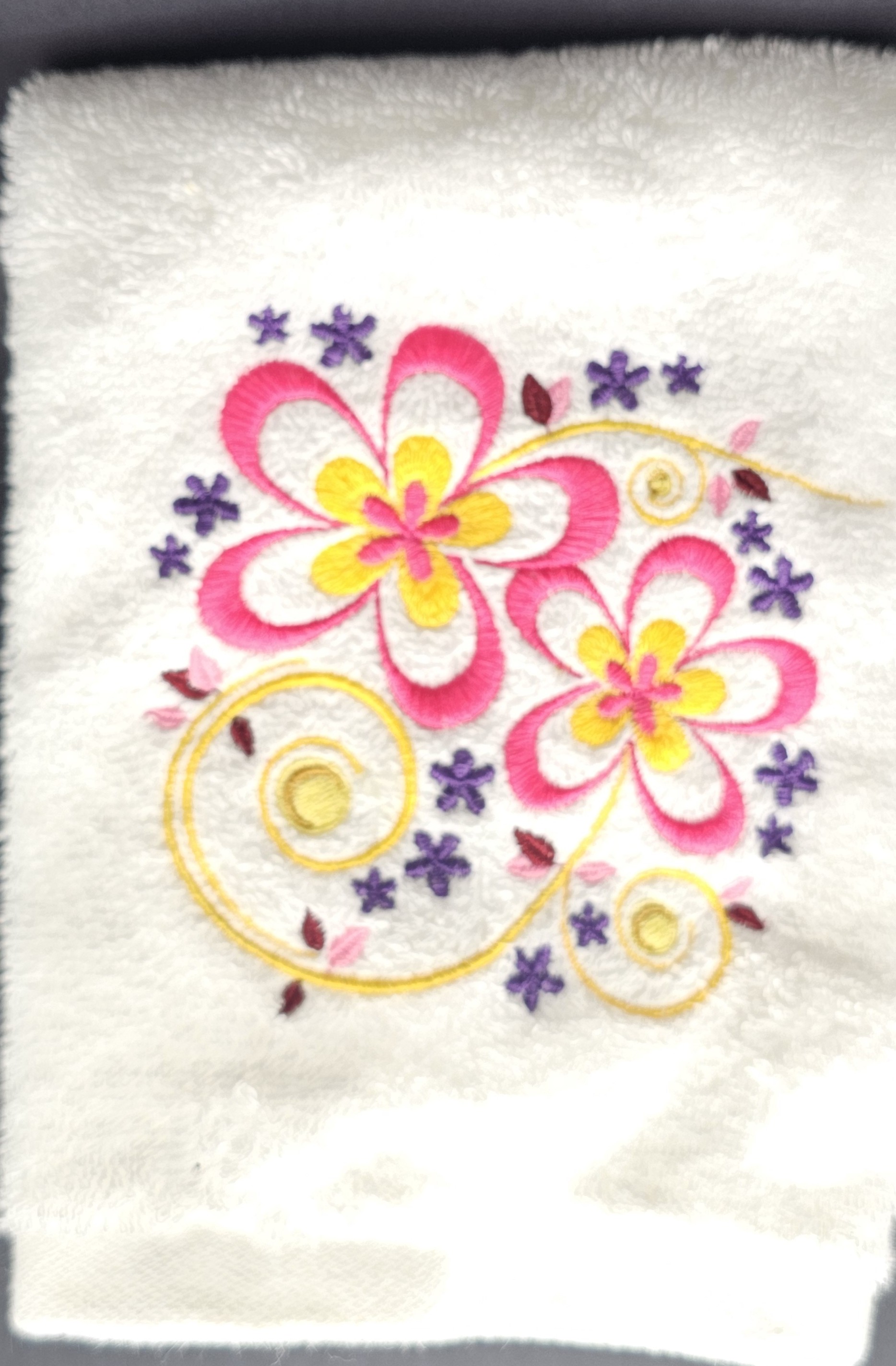 White towel with floral embroidery