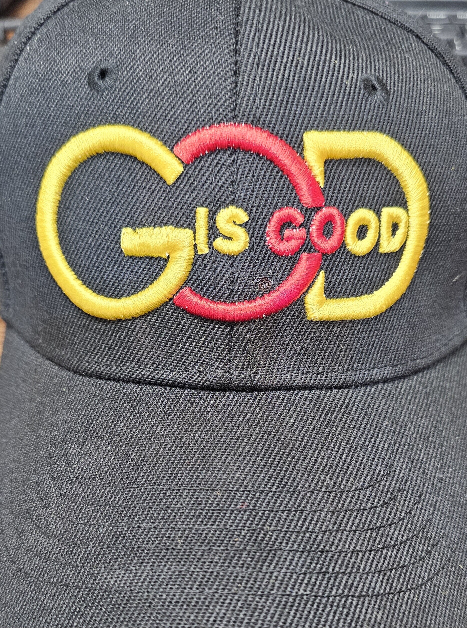 Black hat embroidered with the phrase God is Good
